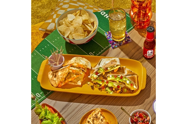 Home made tacos served on a rectangular plate.