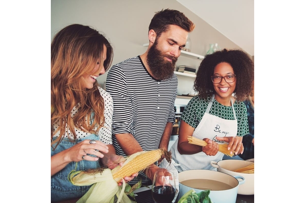 Image Group of friends cooking a vegan meal.