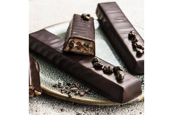 Image Chocolates are placed on a white table.