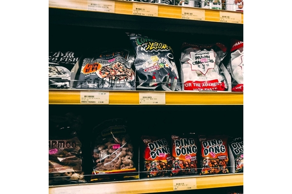 Image A shelf with pre-packaged food on it.