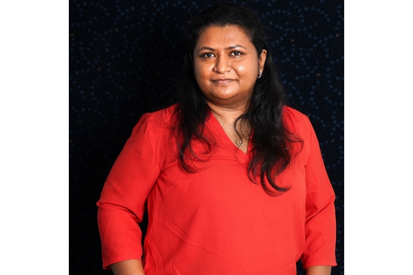 Image A woman in a red shirt.