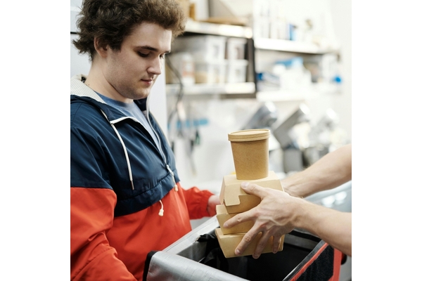 Image food delivery man picking up an order from a restaurant