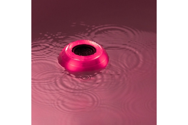 Image A bath bot from Lush in pink water.