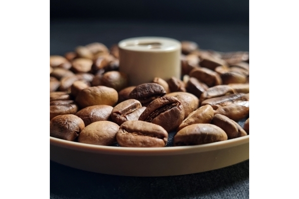 Coffee beans and coffee cup.