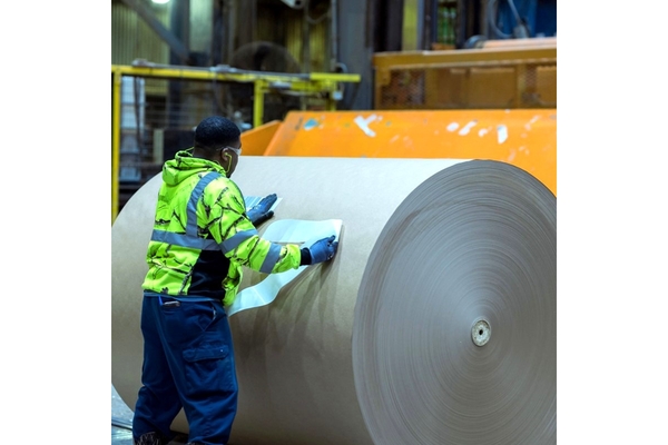 Image Man in paper mill.