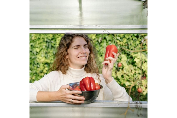 Image Woman hold organic vegetables papers
