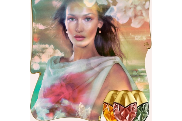 Image Bella Hadid posing with multi-colors all over her face.