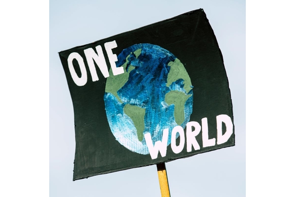 Image poster of globe saying "one world"