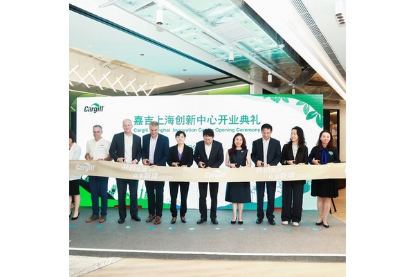 Image Men and women at an innauguration event cutting a ribbon.