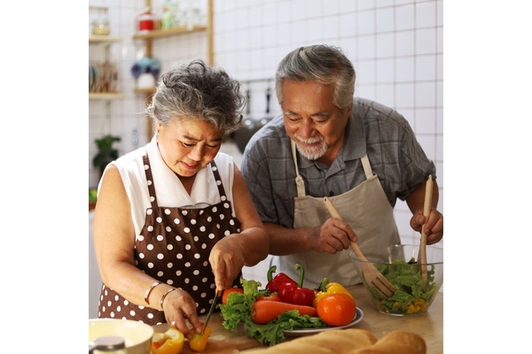 Older couple restricting their diet intake to live longer.