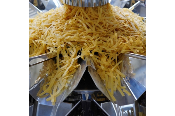 Weighing pasta with machine.