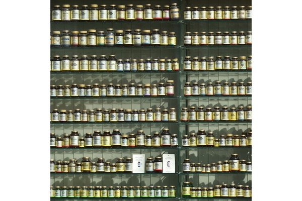 Image Store shelves lined with botanical supplement bottles.