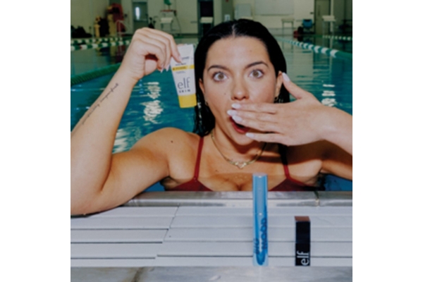 Image Anastasia Pagonis in the pool holding ELF products.