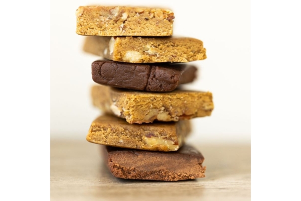 Stack of protein bars with Postbiotic Cultured Protein.