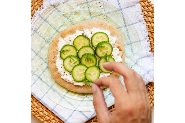 Image upcycled naan with cucumber.