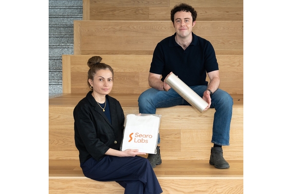 Image A man and woman sitting on stairs