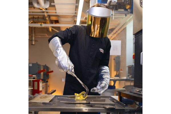Image man in protective gear moulding glass