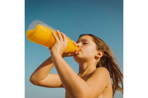 A child drinking from a bottle.