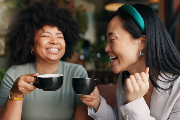 Image Two friends drinking coffee