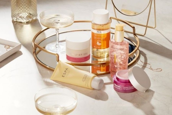 Multiple products from brands owned by THG sitting on a table.