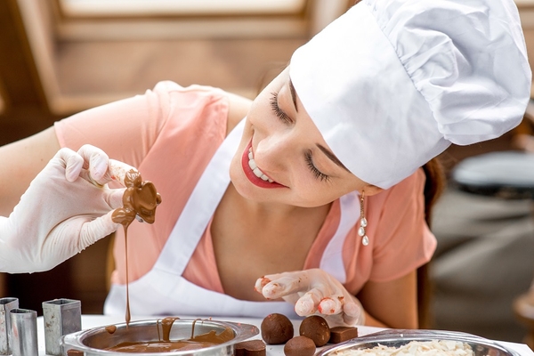 A woman making chocolate.