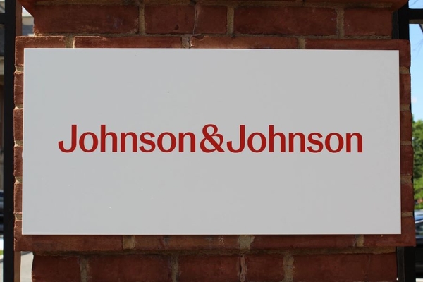 Image Johnson & Johnson sign on the side of a building.
