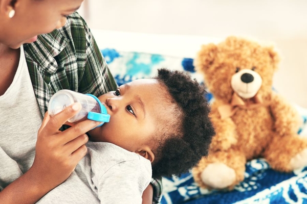 Image Person feeding a baby.