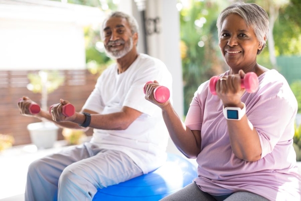Older man and woman exercising.