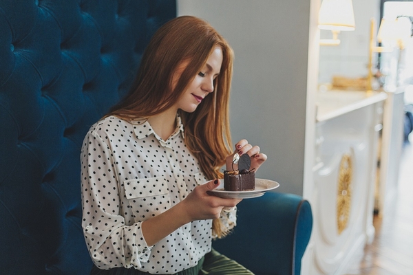 A women taking a pill.