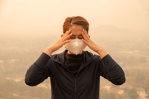 Image Woman frustrated with air pollution