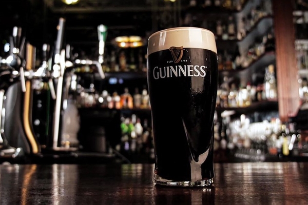 Image A pint of Guinness on a bar