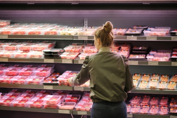 A shopper buying meat.