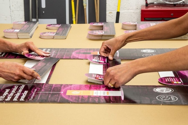 hands using adhesive packaging