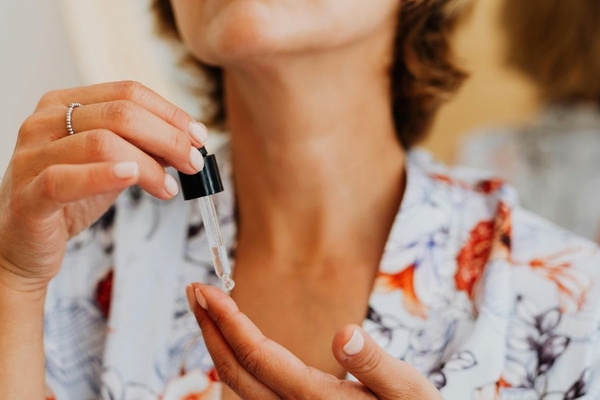 Woman applying serum