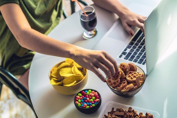 Image Student eating high fat and sugary snacks