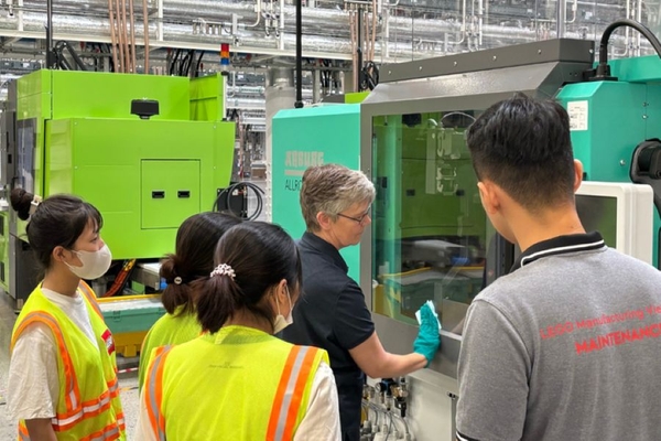 A group of people in a factory.
