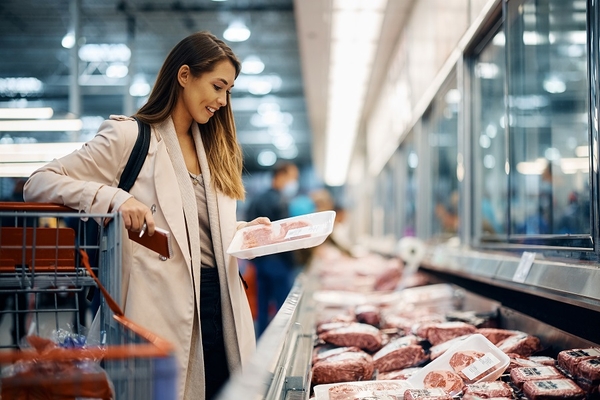 Image A shopper buying meat.