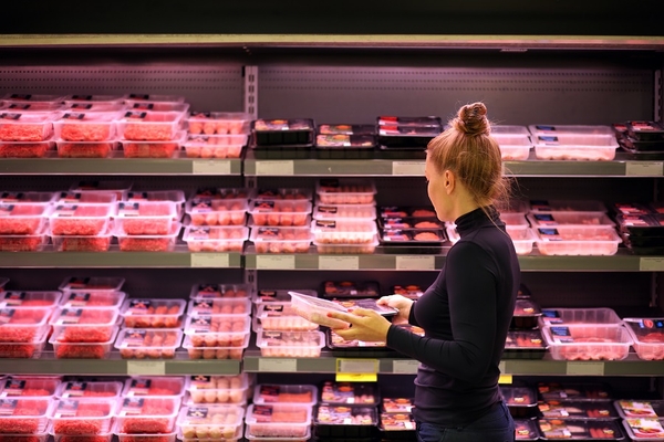 Image woman shopping for meat in supermarket