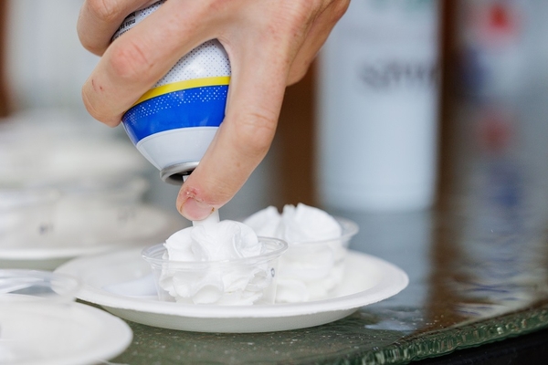 whipped cream oozing out of a can