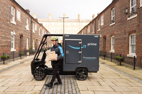 Amazon bike cargo driver delivers package