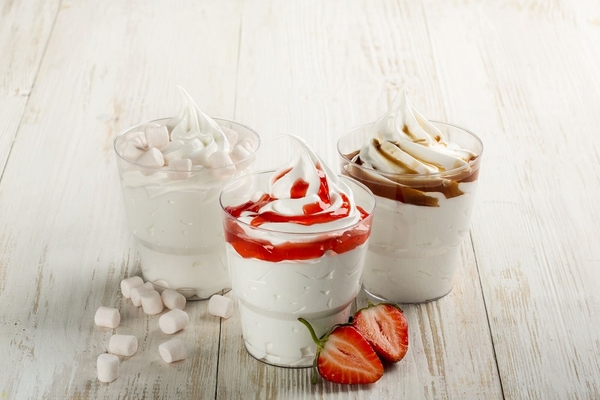 Image soft serve ice cream with sauce in three cups