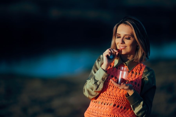 Image Woman enjoying gummy supplement