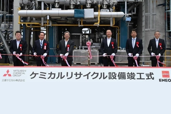 Image A group of men in suits and gloves holding a ribbon.
