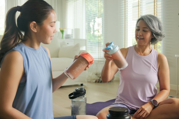 Image Two women with protein shakes