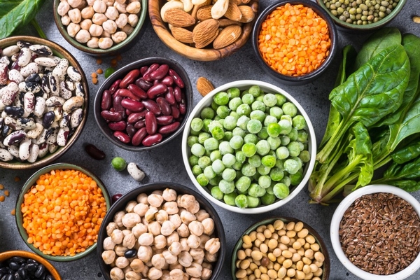 Image Legumes, beans, lentils, nuts, broccoli, spinach and seeds.