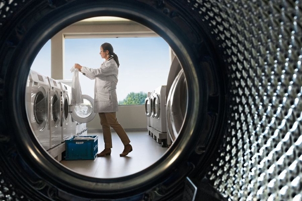 scientist standing by washing machines
