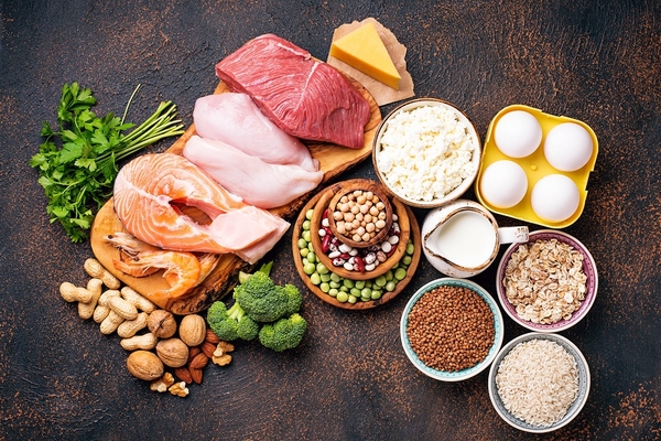 Image eggs meat and beans on black background