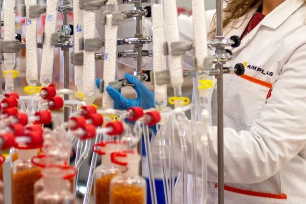 Image scientist looking at tube
