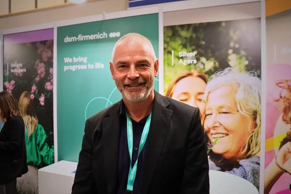 Image man standing by the dsm-firmenich booth at SEPAWA 2025