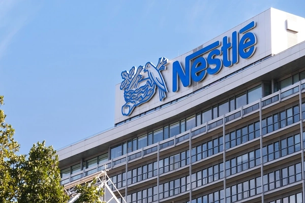 Image nestle building with blue and white logo and birds